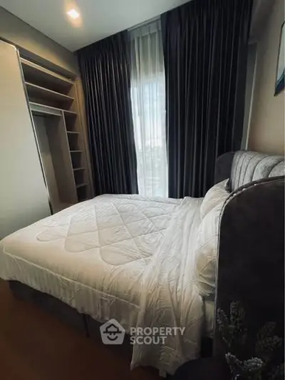 Cozy bedroom with elegant curtains and modern design