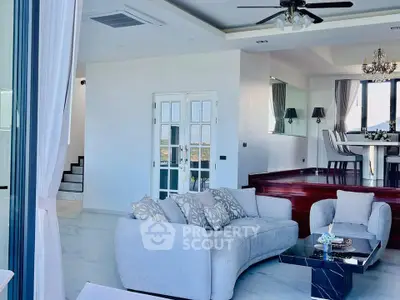 Luxurious open-plan living room with elegant dining area and modern decor