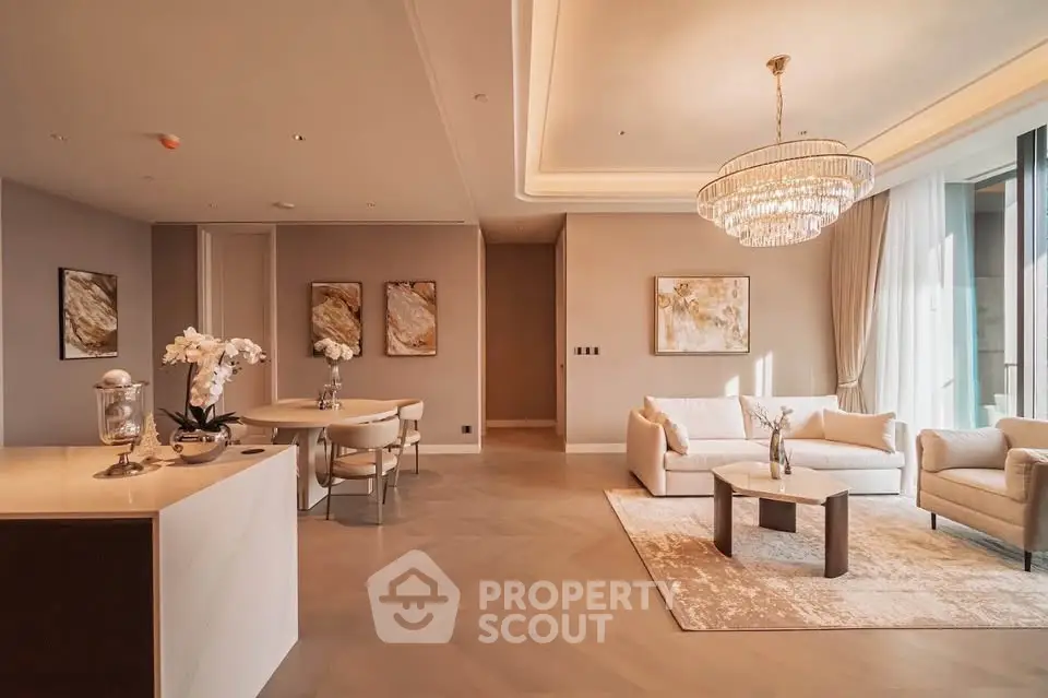 Luxurious open-plan living room with elegant chandelier and modern decor