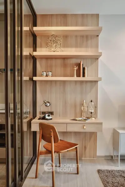 Modern study area with wooden desk and shelves in a stylish apartment
