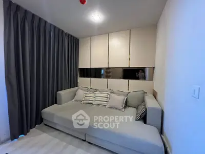 Cozy living room with modern sofa and elegant curtains