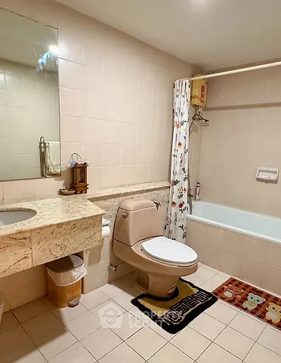 Spacious bathroom with elegant marble countertop and bathtub in modern apartment.