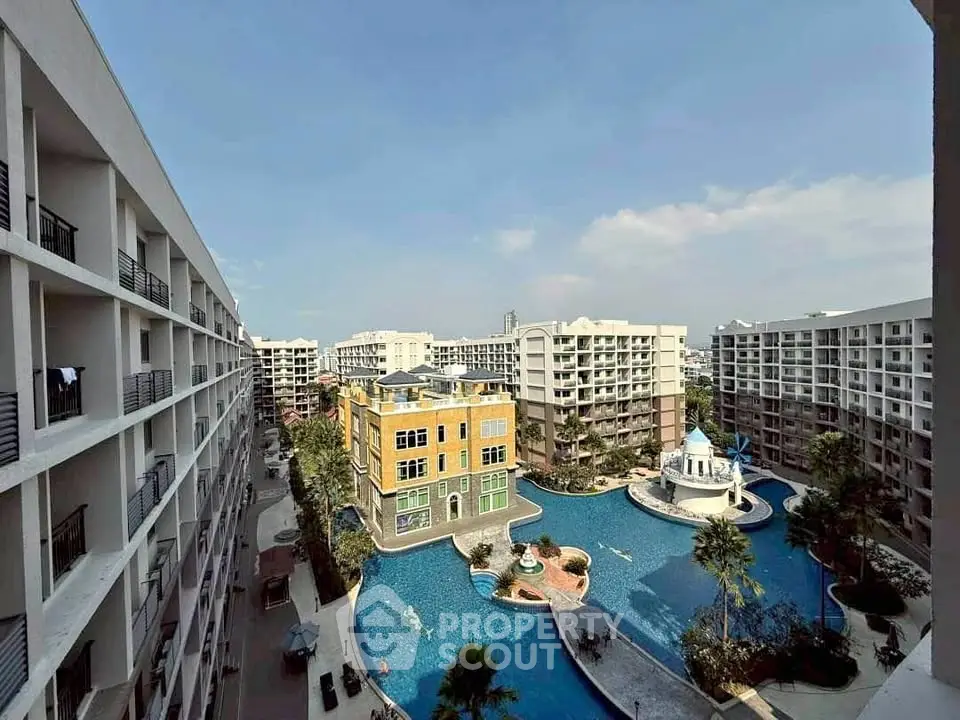Luxurious resort-style apartment complex with stunning pool and modern architecture.