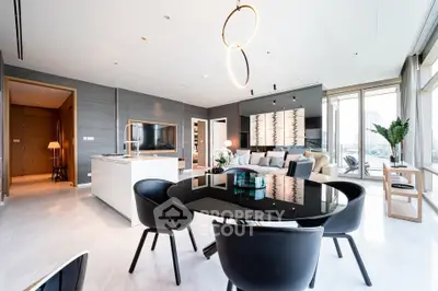 Luxurious modern living room with open kitchen and stunning city view