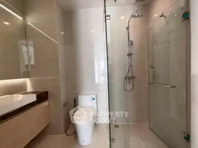 Modern bathroom with glass shower and sleek fixtures