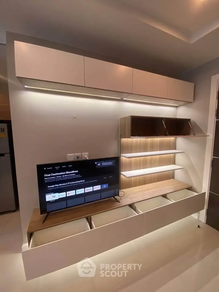 Modern living room with sleek entertainment unit and ambient lighting