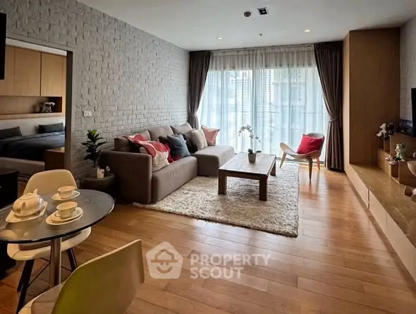 Spacious modern living room with cozy decor and natural light