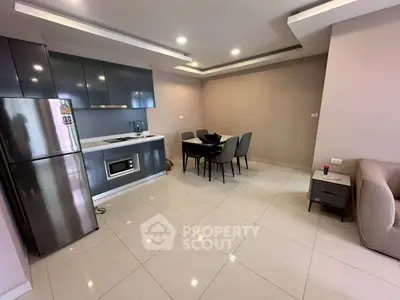 Modern kitchen and dining area with sleek design and ample space