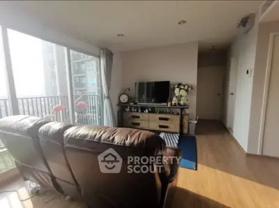 Bright living room with modern decor and balcony view
