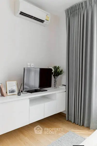 Modern living room with sleek TV setup and elegant decor
