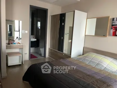 Modern bedroom with ensuite bathroom and stylish decor in a contemporary apartment.