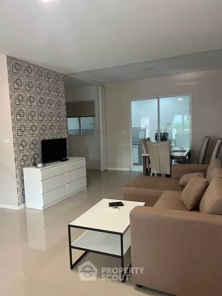 Modern living room with stylish furniture and open layout, perfect for entertaining guests.