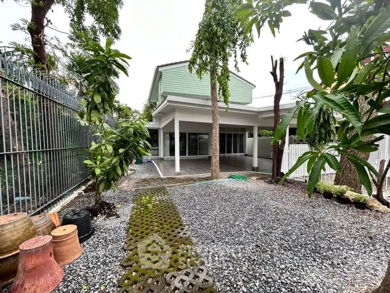 Charming residential property with spacious garden and modern exterior design.