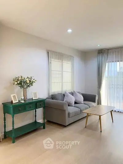 Spacious living room with modern decor and natural light