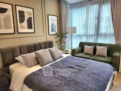 Stylish bedroom with modern decor and large windows in a cozy apartment.
