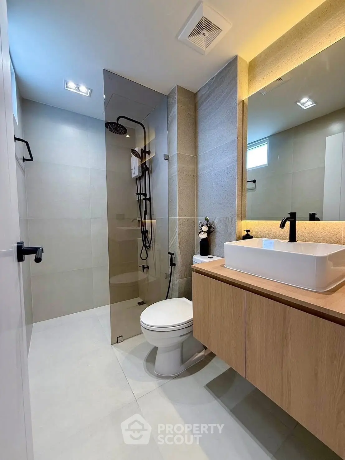 Modern bathroom with sleek fixtures and glass shower enclosure