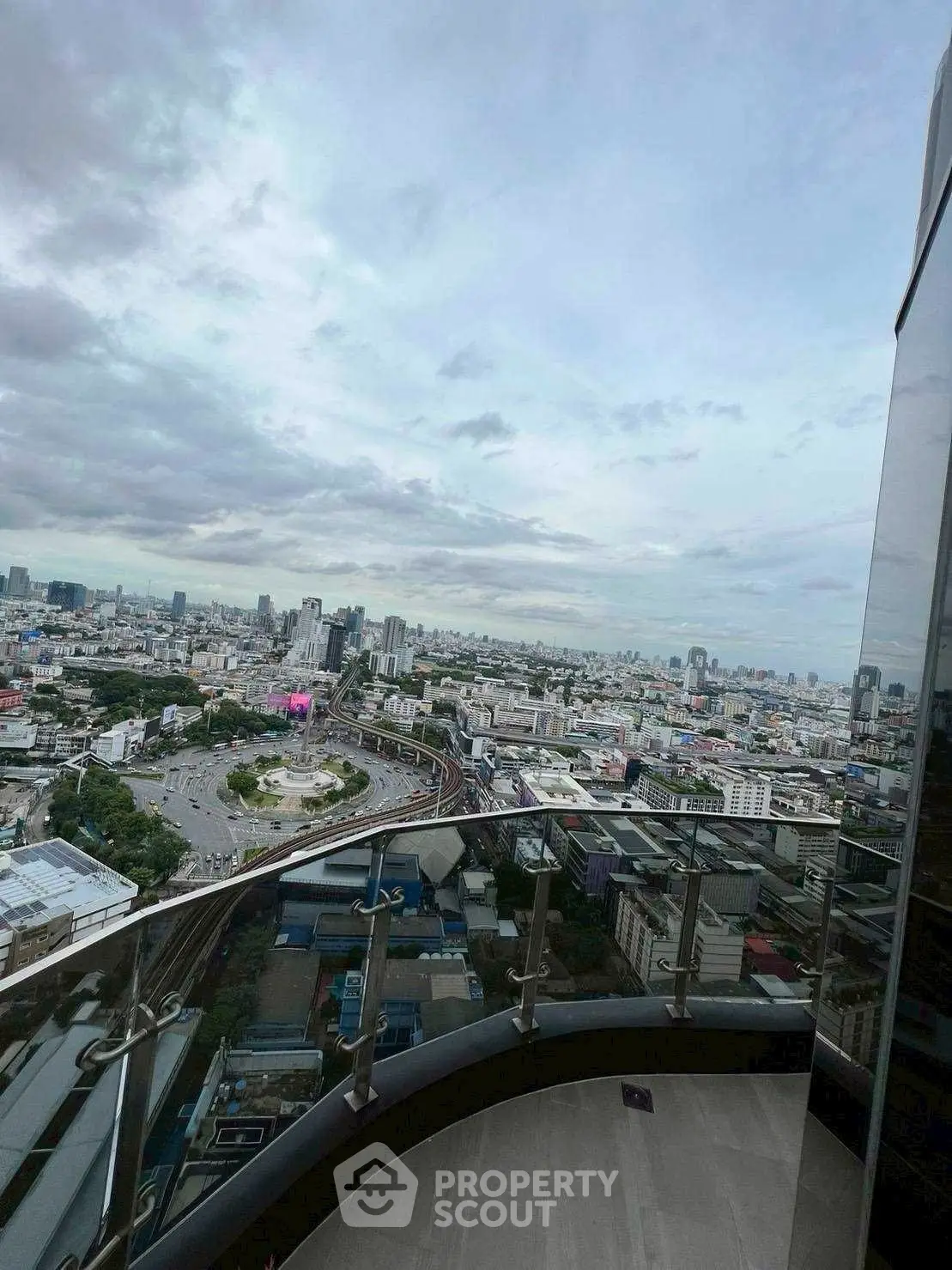 Stunning cityscape view from a high-rise balcony, perfect for urban living enthusiasts.