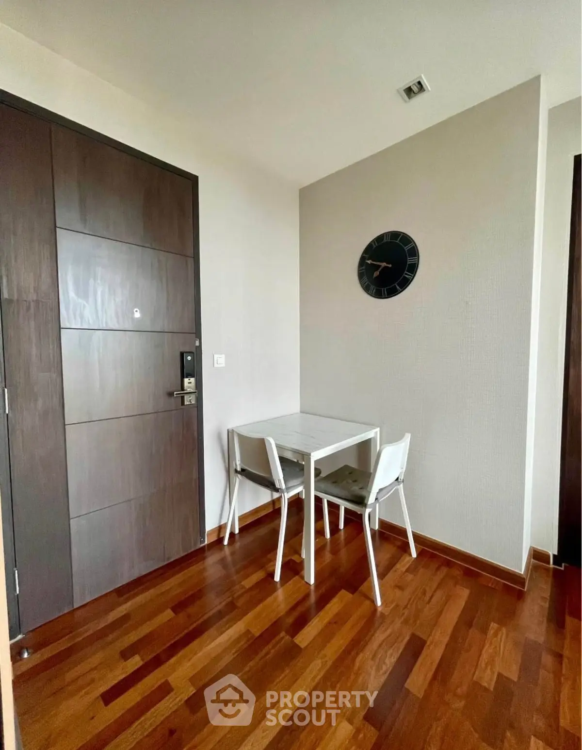 Cozy dining nook with wooden flooring and modern decor