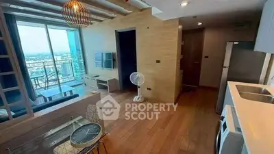 Modern living room with balcony view in high-rise apartment
