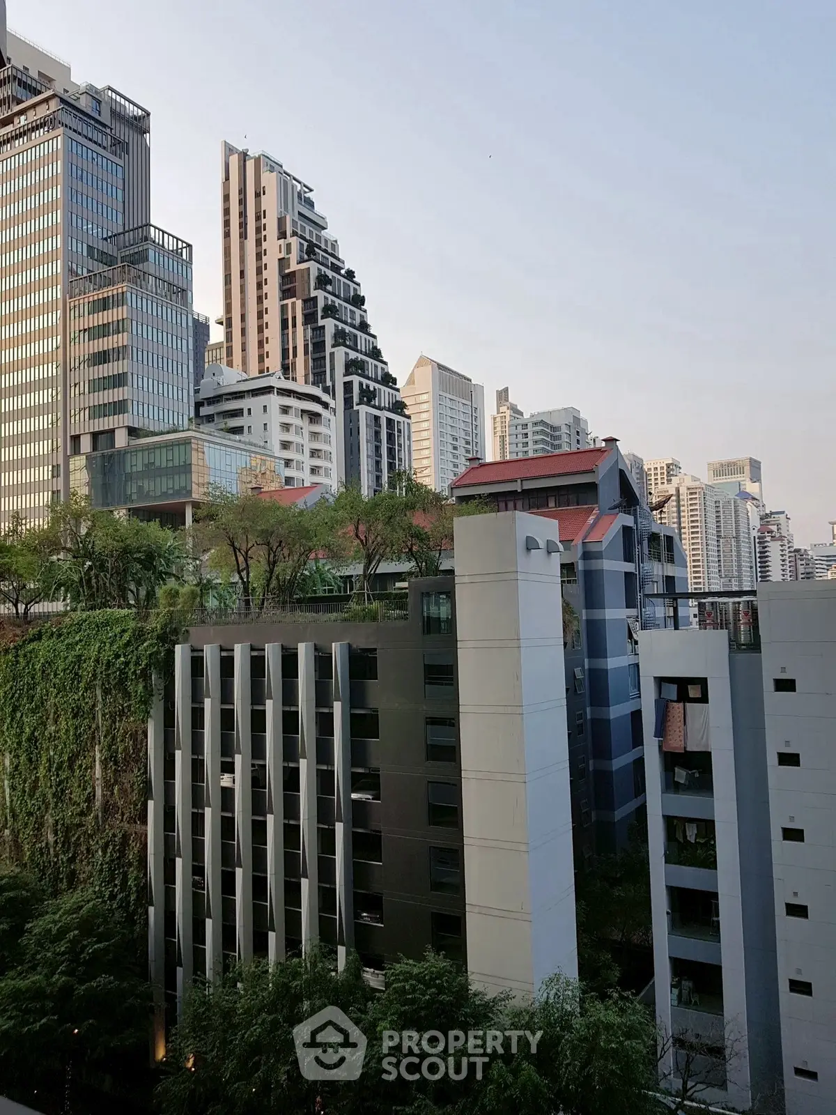 Stunning urban skyline with modern high-rise buildings and lush greenery