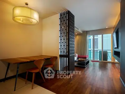 Modern living room with wooden flooring and stylish dining area