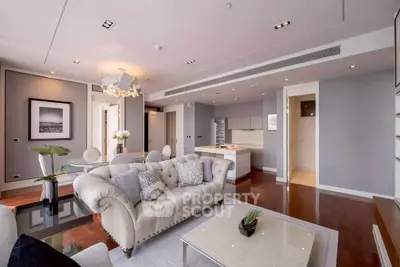 Luxurious modern living room with elegant decor and open kitchen layout