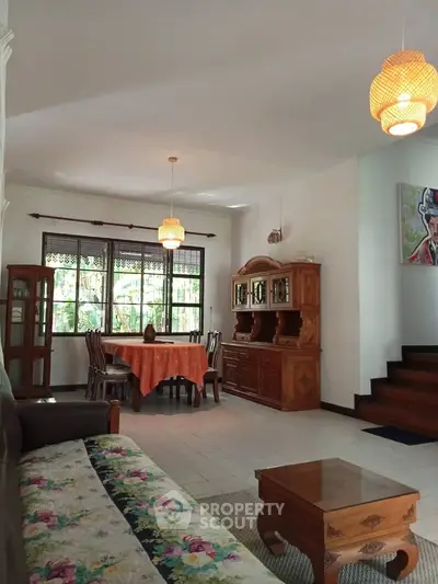 Charming living room with vintage wooden furniture and natural light