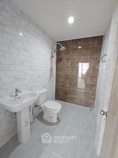 Modern bathroom with sleek tiles and contemporary fixtures