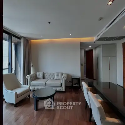 Spacious modern living room with elegant furniture and wooden flooring