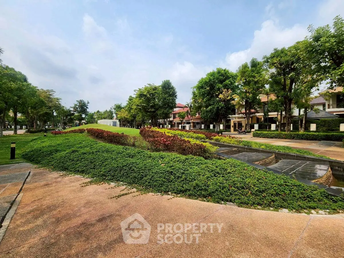 Beautiful residential garden with lush greenery and modern homes