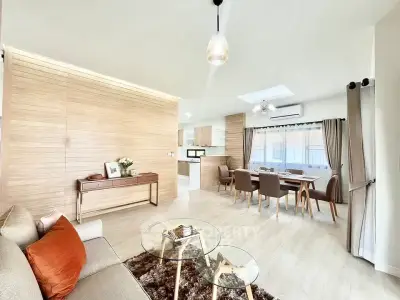 Spacious modern living room with open layout and elegant dining area