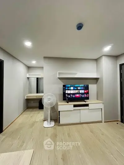 Modern living room with sleek TV setup and minimalist decor