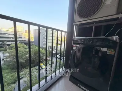 Modern balcony with city view and washing machine, perfect for urban living.