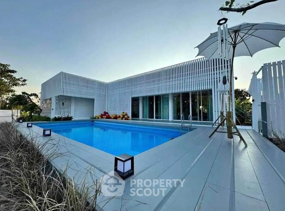 Modern minimalist home with sleek pool and stylish exterior design