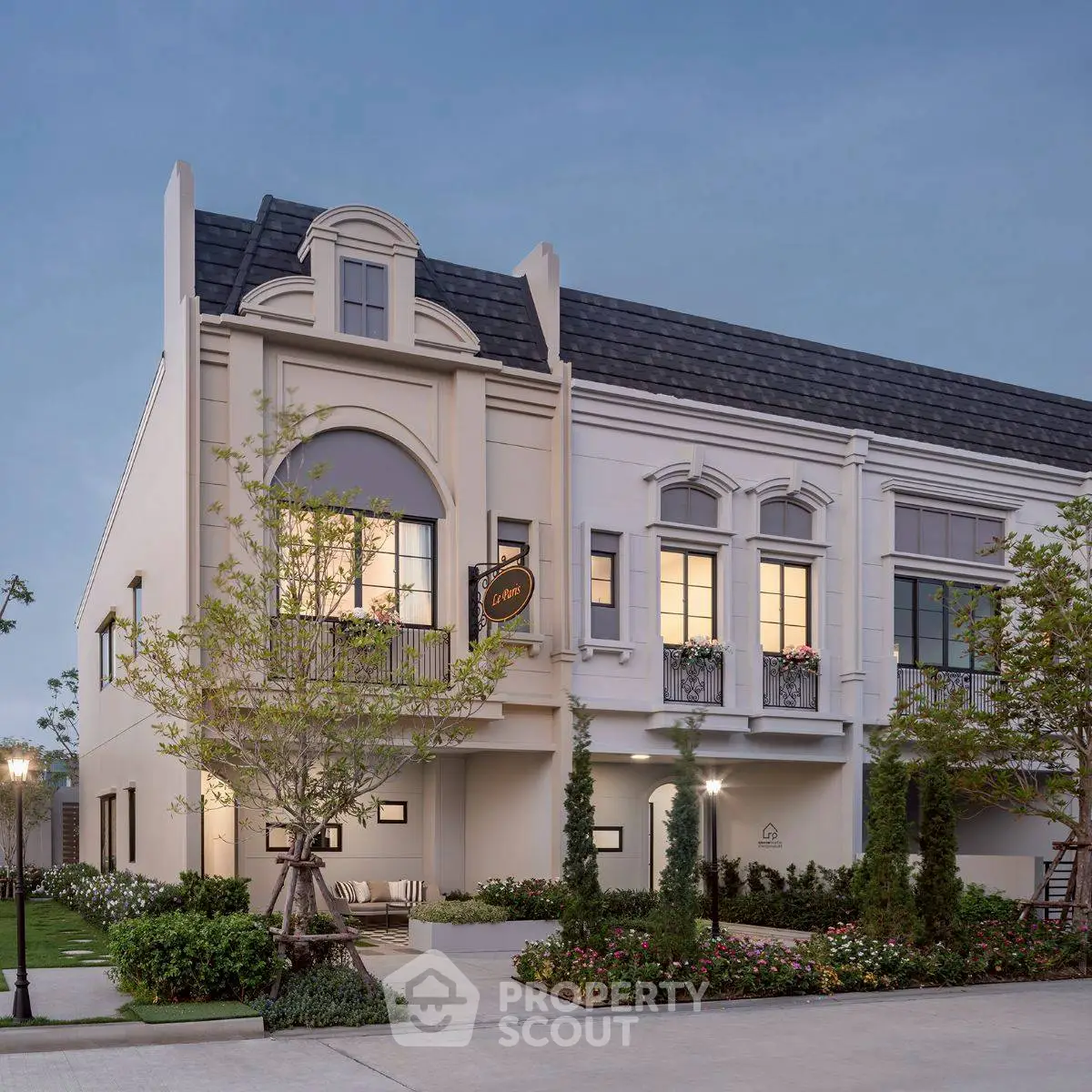 Elegant townhouse exterior with classic architecture and lush landscaping, perfect for modern living.