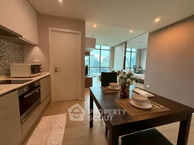 Modern open-plan kitchen and dining area with city view