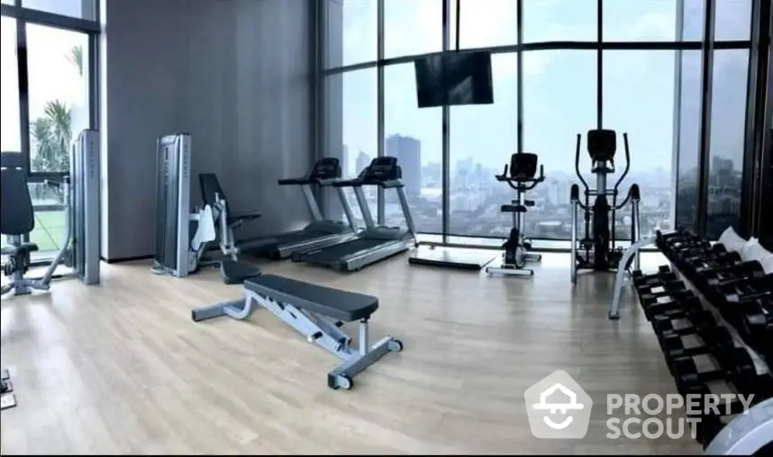 Modern gym with panoramic city views and state-of-the-art equipment