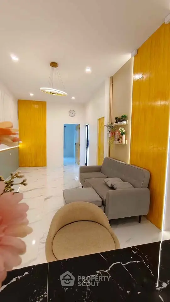 Modern living room with stylish furniture and elegant lighting in a contemporary home.