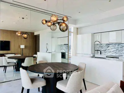Luxurious modern kitchen and dining area with elegant lighting and marble accents