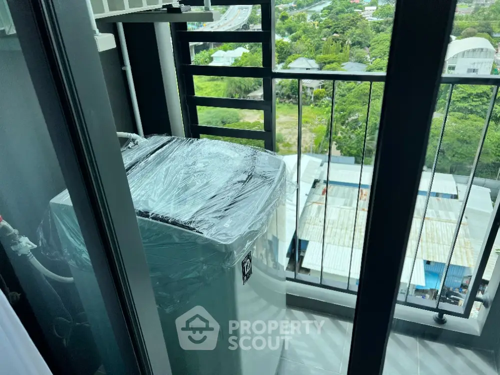 Compact balcony with washing machine and scenic view