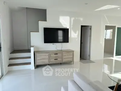 Modern living room with sleek TV setup and minimalist decor