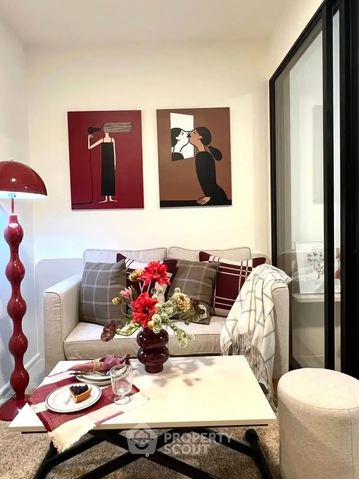 Chic living room with modern decor, stylish artwork, and cozy seating area perfect for relaxation.