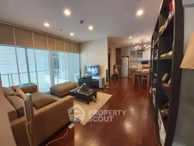 Spacious modern living room with open kitchen and elegant wooden flooring