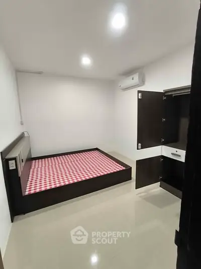 Modern bedroom with built-in storage and sleek design