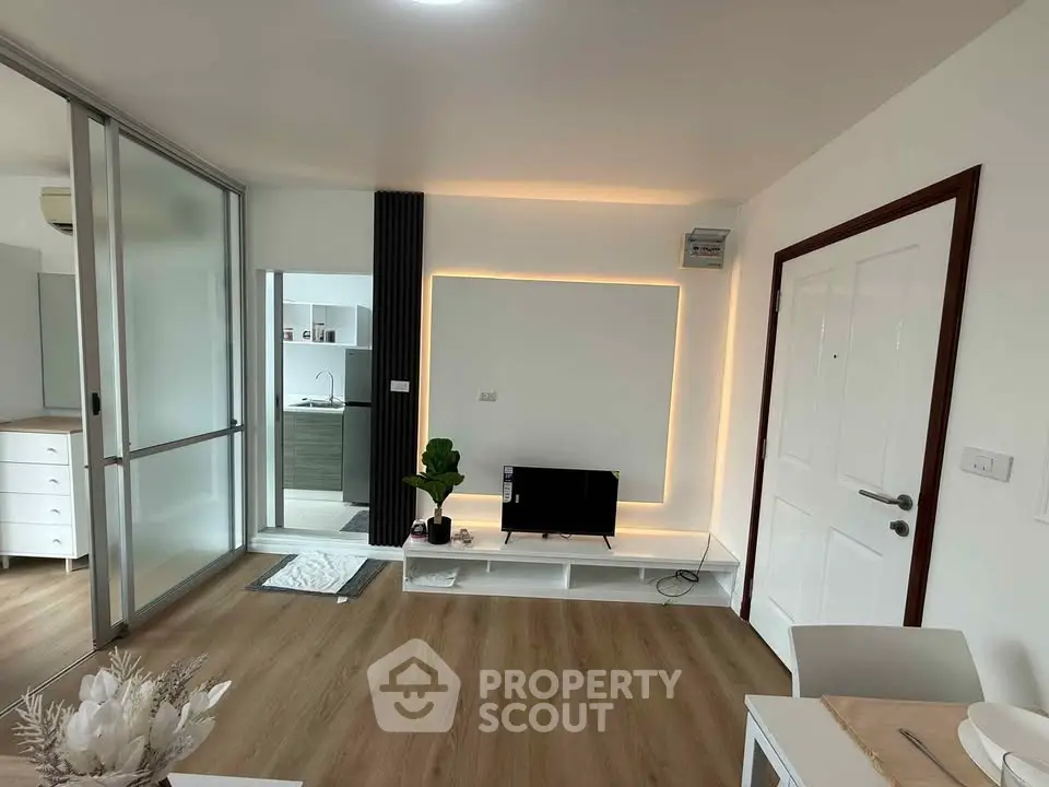 Modern living room with sleek design and ambient lighting