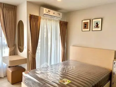 Modern bedroom with stylish decor, featuring a comfortable bed, elegant curtains, and wall art.