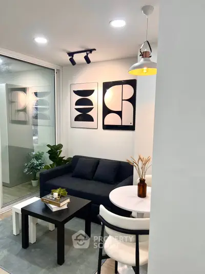 Modern living room with stylish decor and cozy seating area, perfect for relaxation and entertaining.