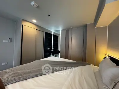 Modern bedroom with sleek built-in wardrobes and cozy lighting