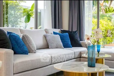 Luxurious modern living room with elegant decor and plush seating, perfect for relaxation and entertaining.