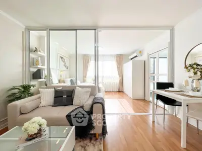 Modern open-plan living room with stylish decor and natural light